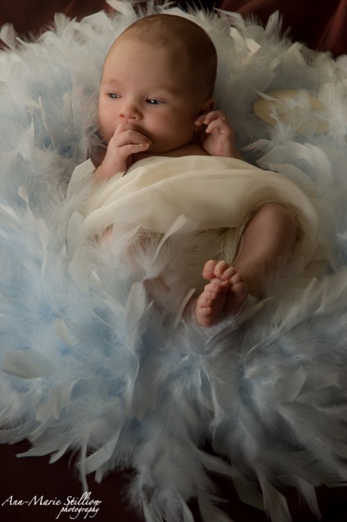 Baby in feathers